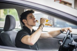 drunk drivers man drinking and driving